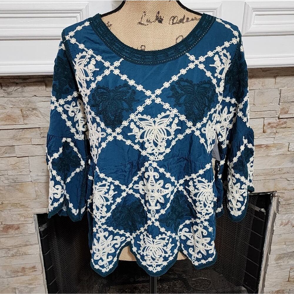 Anthropologie x Kindred teal and white heavily embroidered triangle trim shirt